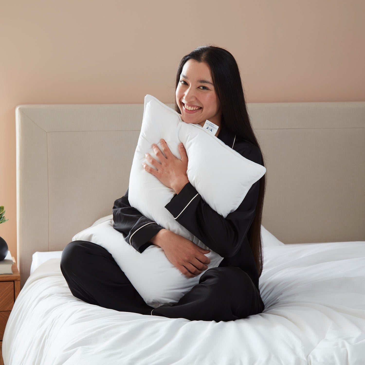 Model hugging Chamberlain Down Pillow
