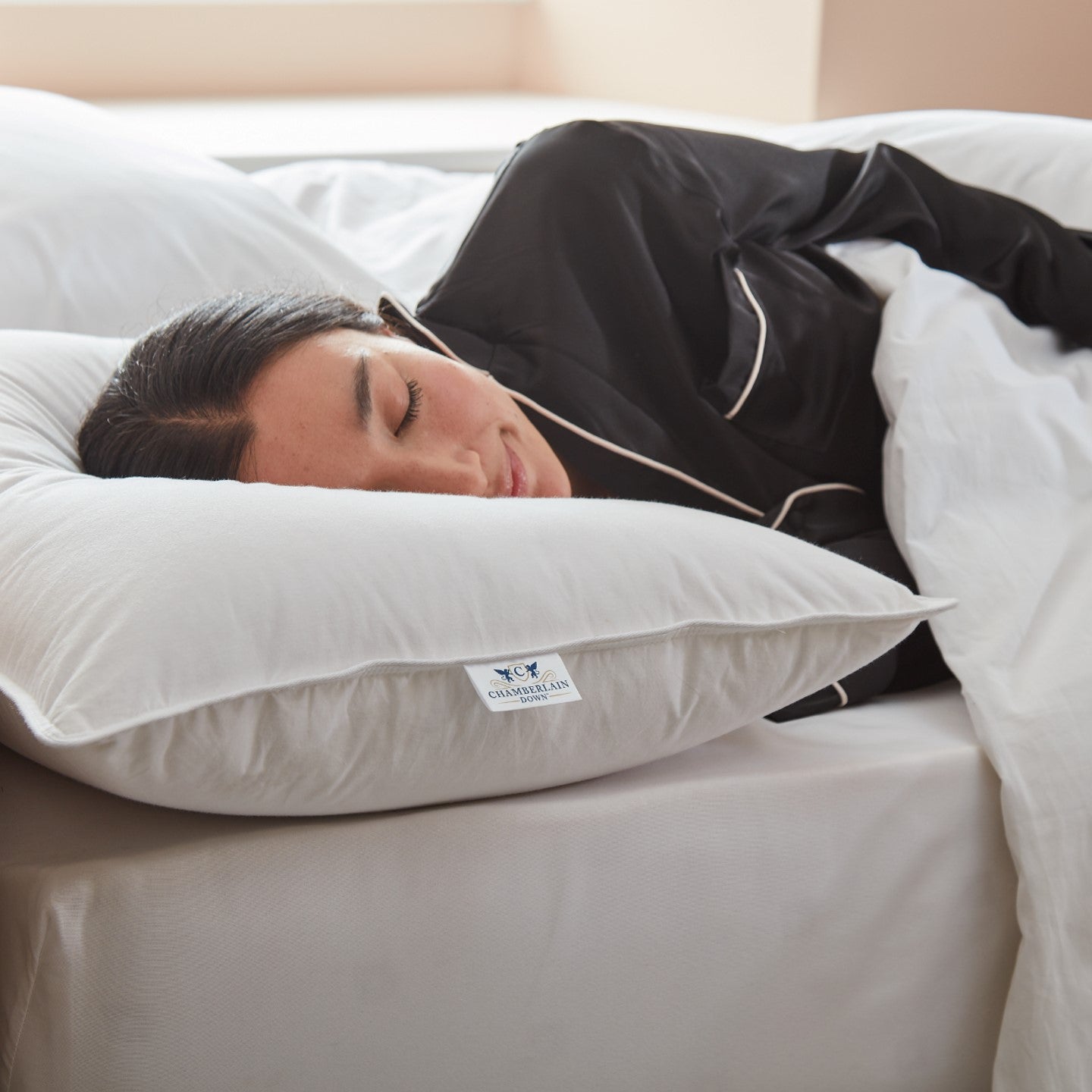 Model side-sleeping on Chamberlain Down Pillow